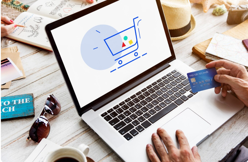 Online shopping with credit card on laptop