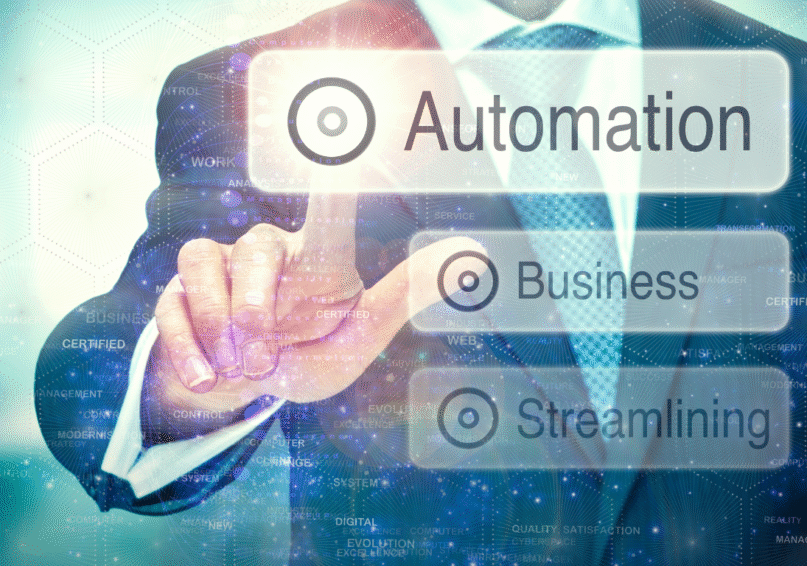 Businessman using laptop with automation icons