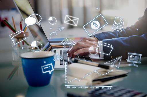 Person typing on laptop with digital business and communication icons